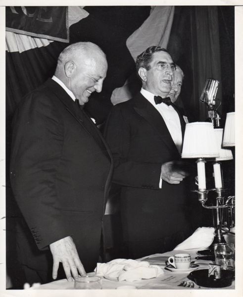 Col. Garnett Day (r) is shown addressing the guests attending a testimoial dinner to Brig. Gen. John R. Kilpatrick (l) after the latter presented him with the Legion of Merit Medal in recognition of this work with the army at Newport News, VA.
